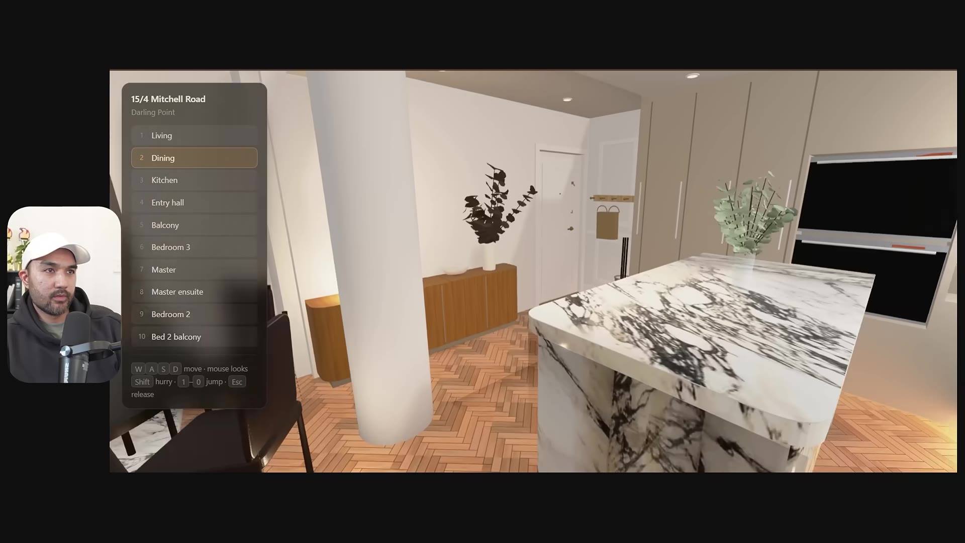 The finished explorable 3D apartment walkthrough: a first-person view of the kitchen with a marble island and a room-navigation menu
