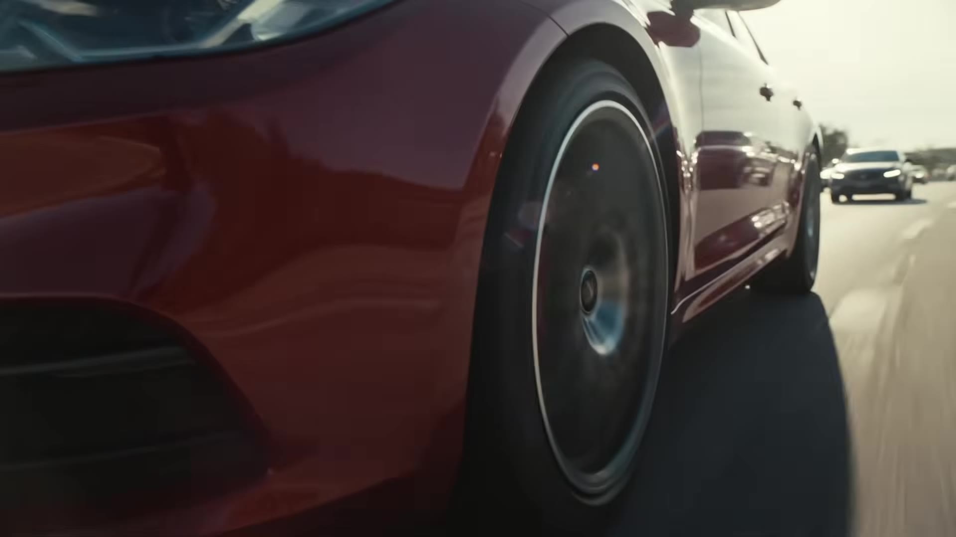 Tunnel beauty-pass: tight wheel close-up, paint lighting up