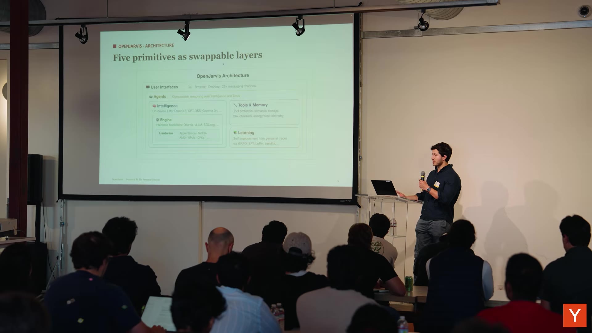 OpenJarvis architecture slide "Five primitives as swappable layers": user interfaces, agents, intelligence, engine, hardware, tools and memory, and learning